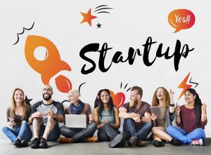 Startup Business Progress Strategy Enterprise - Kickstart Bahrain - Kickstart Bahrain Entrepreneurs collaborating at a shared workspace desk